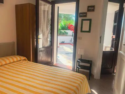 Letto o letti in una camera di Casa Elicriso