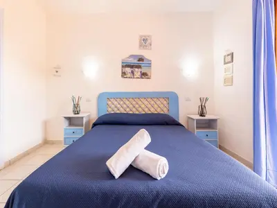 Letto o letti in una camera di Relax on the Bay of Marinella