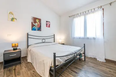 Letto o letti in una camera di AffittaSardegna - Appartamenti Appentos