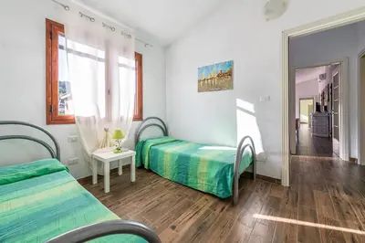 Letto o letti in una camera di AffittaSardegna - Appartamenti Appentos