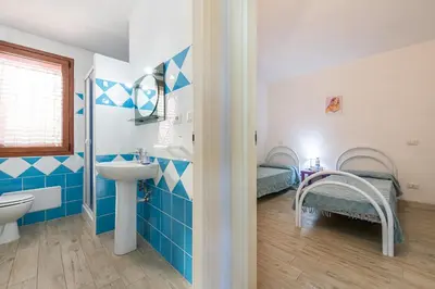Letto o letti in una camera di AffittaSardegna - Appartamenti Appentos