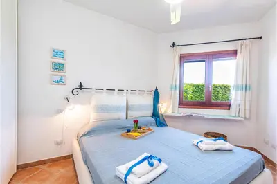 Letto o letti in una camera di Sweet Home Tavolara - Happy Rentals