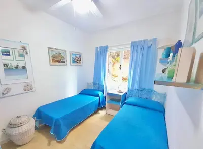 Area soggiorno di Apartment 5 beds with fenced garden in Marinella just 300 mt from the beach