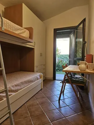 Letto o letti in una camera di Il Giardino Fiorito