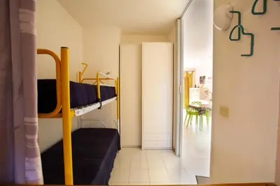 Letto o letti in una camera di Residence Porto Coda Cavallo