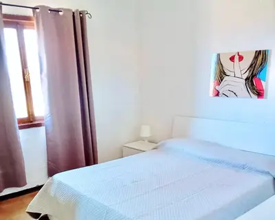 Letto o letti in una camera di Apartment 6 beds in Marinella just 300 mt from the beach