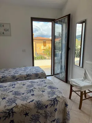 Letto o letti in una camera di Villa Pierina