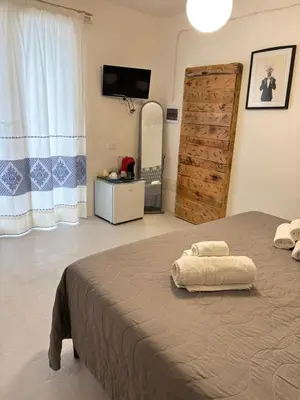 Letto o letti in una camera di Domo Nea