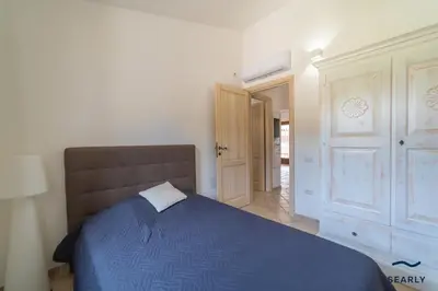 Letto o letti in una camera di Villa Filomena Appartamento Con Piscina By Searly