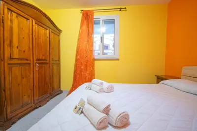 Letto o letti in una camera di Le due palme