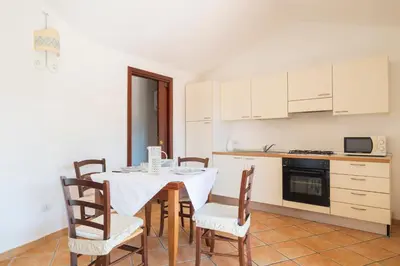 Cucina o angolo cottura di Residence Ottiolu Vecchio Pozzo