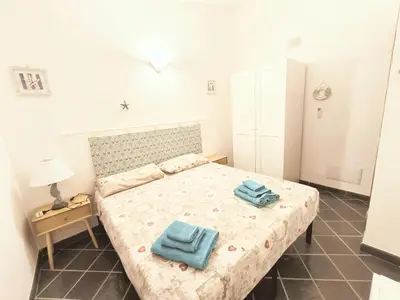 Letto o letti in una camera di HH San Teodoro - Four-room Sea View - Unit A
