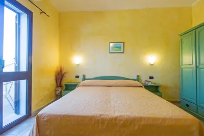 Letto o letti in una camera di Hotel Gli Ontani