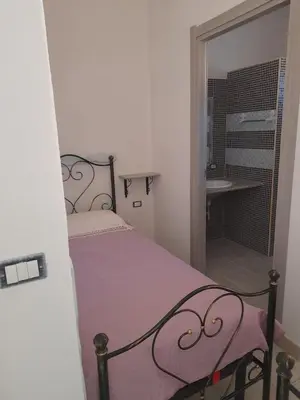 Letto o letti in una camera di Casa Grazia Deledda 16