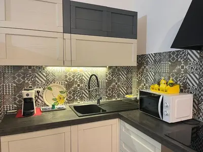 Cucina o angolo cottura di Splendido Appartamento San Teodoro Budditogliu con Jacuzzi