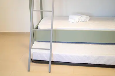 Letto o letti in una camera di CNC Vacanze Sardegna