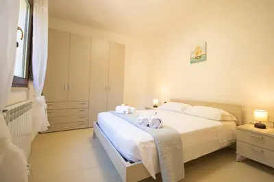 Letto o letti in una camera di CNC Vacanze Sardegna