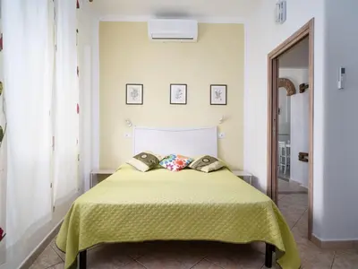 Letto o letti in una camera di Apartment Wohnung 'Casa Sale' mit Bergblick by Interhome