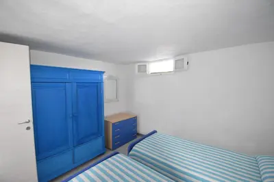 Letto o letti in una camera di Appartamento sulla spiaggia indipendente