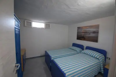 Letto o letti in una camera di Appartamento sulla spiaggia indipendente