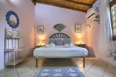 Letto o letti in una camera di Villa Raja - 5 min dalla spiaggia - con parcheggio