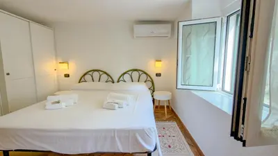 Letto o letti in una camera di Casa CarMa - Relax & Comfort a Cala Gonone