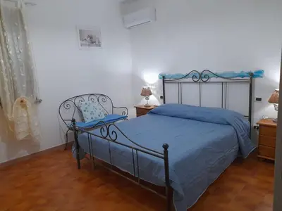 Letto o letti in una camera di Casa Dessy