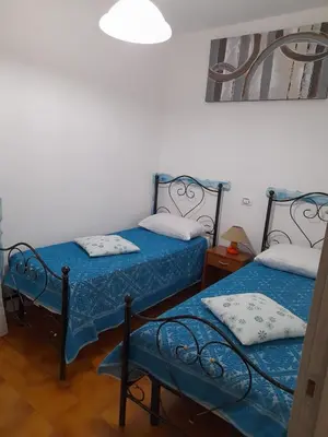 Letto o letti in una camera di Casa Dessy