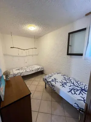 Letto o letti in una camera di villa lucia