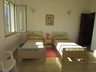 Letto o letti in una camera di House between wild sea, nature, and authentic villages