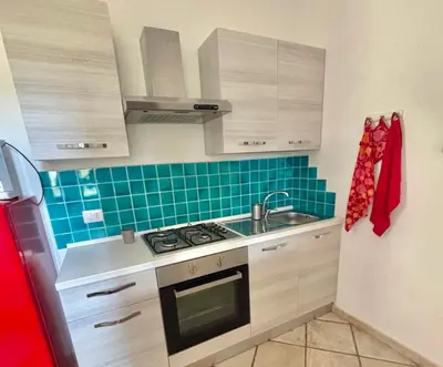 Cucina o angolo cottura di ISS Travel, Apartment Euro in San Teodoro, groundfloor, 2 bedrooms, 6 beds, with air conditioning