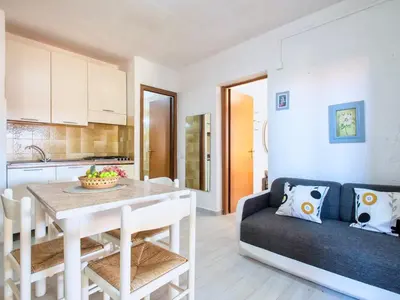 Cucina o angolo cottura di Apartment 3 beds ground floor with garden in Marinella just 100 mt from the beach