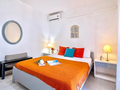 Letto o letti in una camera di Apartment 3 beds ground floor with garden in Marinella just 100 mt from the beach