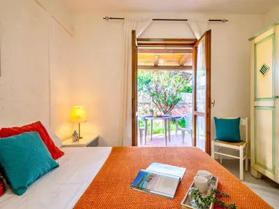 Letto o letti in una camera di Apartment 3 beds ground floor with garden in Marinella just 100 mt from the beach