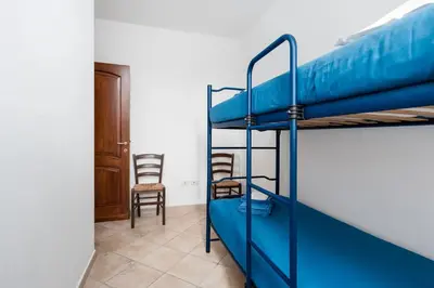 Letto o letti a castello in una camera di Su Nidu Virde