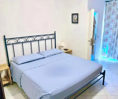 Letto o letti in una camera di Apartment 3 bedrooms, 2 bathrooms in Marinella just 70 mt from the sea