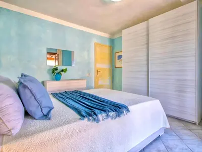 Letto o letti in una camera di Apartment two bedrooms in Marinella just 150 mt from the sea