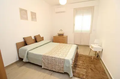 Letto o letti in una camera di Chiara House
