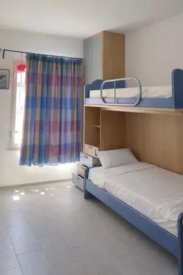 Letto o letti in una camera di Casa Perla