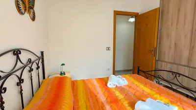 Letto o letti in una camera di Casa Duna 'E Mare con accesso diretto alla spiaggia
