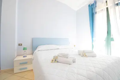 Letto o letti in una camera di Villa Stella Maris