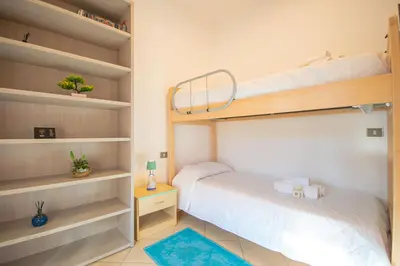 Letto o letti in una camera di Villa Stella Maris