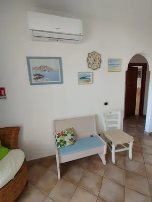 Area soggiorno di Apartment La Pala del Fico d'India, Tiriddò Porto San Paolo, with shared swimming pool