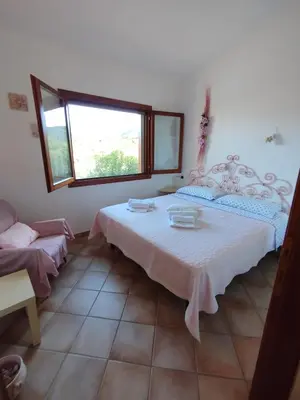 Letto o letti in una camera di Apartment La Pala del Fico d'India, Tiriddò Porto San Paolo, with shared swimming pool
