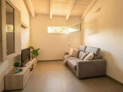 Area soggiorno di Apartment Sutt'e Riu by Interhome