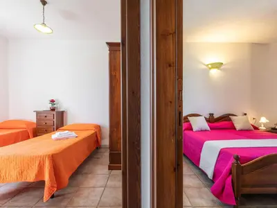 Letto o letti in una camera di Apartment Pompia-2 by Interhome