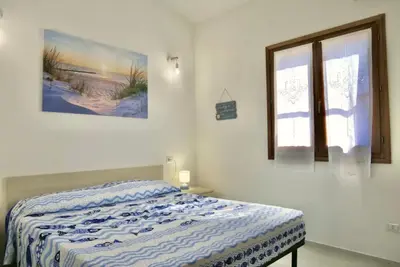 Letto o letti in una camera di ISS Travel, Casa Lucky in San Teodoro just 500 mt from La Cinta beach