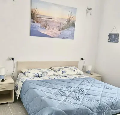 Letto o letti in una camera di ISS Travel, Casa Lucky in San Teodoro just 500 mt from La Cinta beach