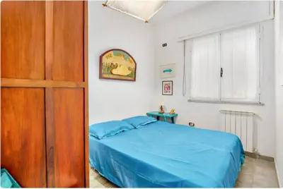 Letto o letti in una camera di Villa Sulas