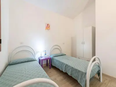 Letto o letti in una camera di Lovely detached villa in Capo Comino